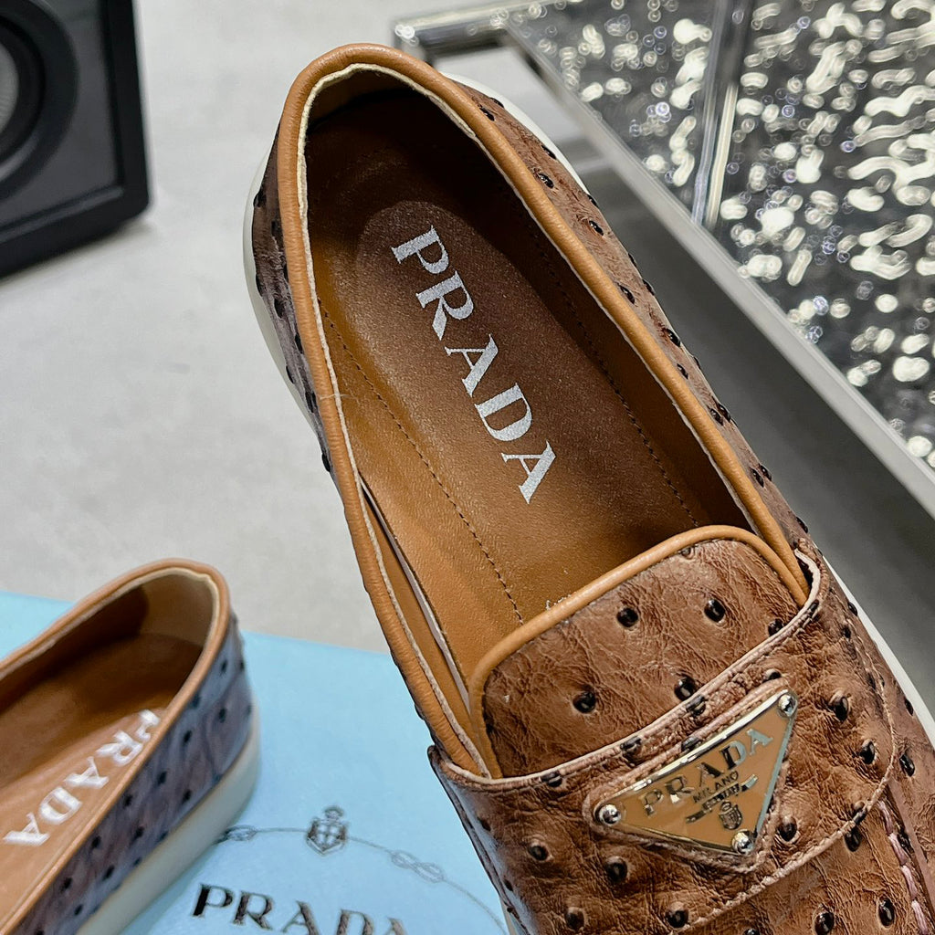 Ostrich Grain Metal Triangle Badge Slip-On Loafers S283422