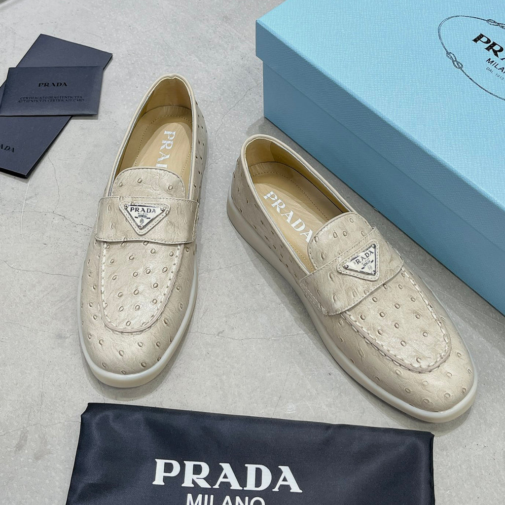 Ostrich Grain Metal Triangle Badge Slip-On Loafers S283422