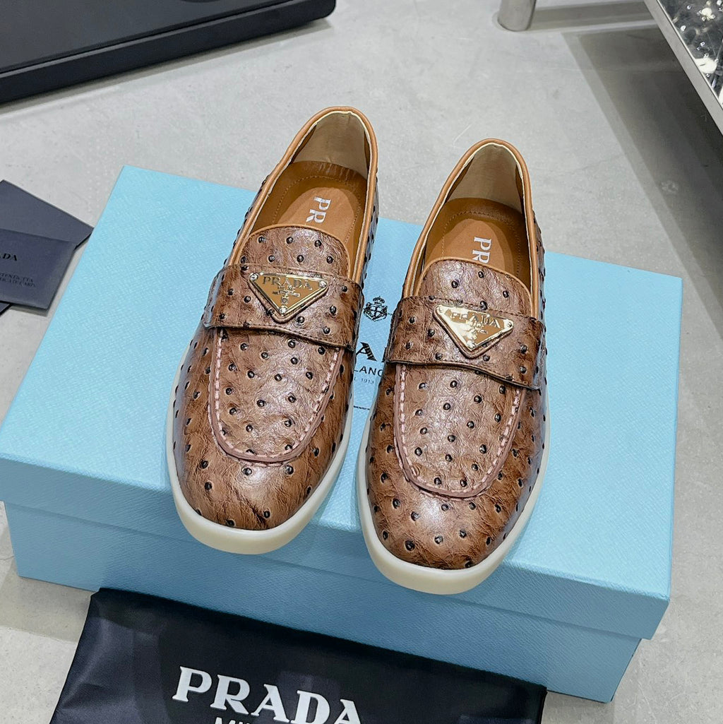 Ostrich Grain Metal Triangle Badge Slip-On Loafers S283422