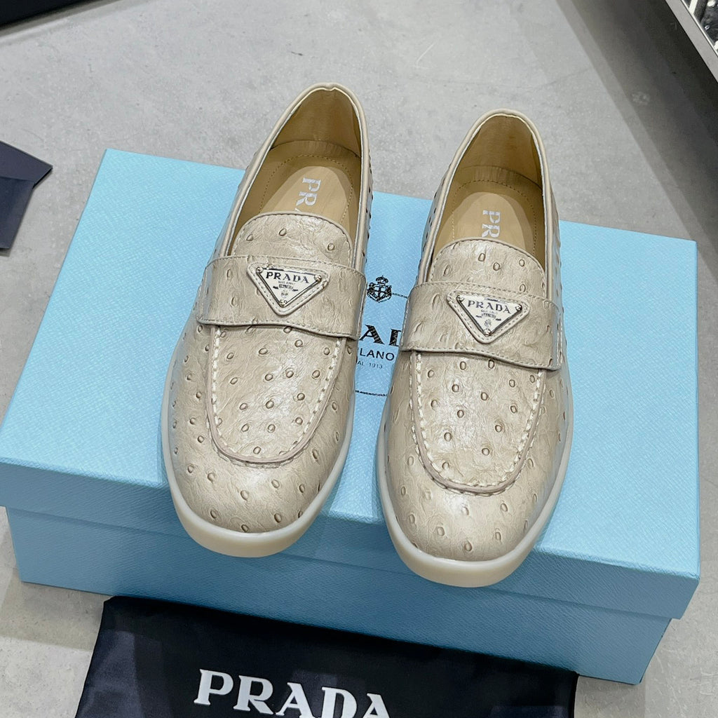 Ostrich Grain Metal Triangle Badge Slip-On Loafers S283422