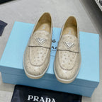 Ostrich Grain Metal Triangle Badge Slip-On Loafers S283422
