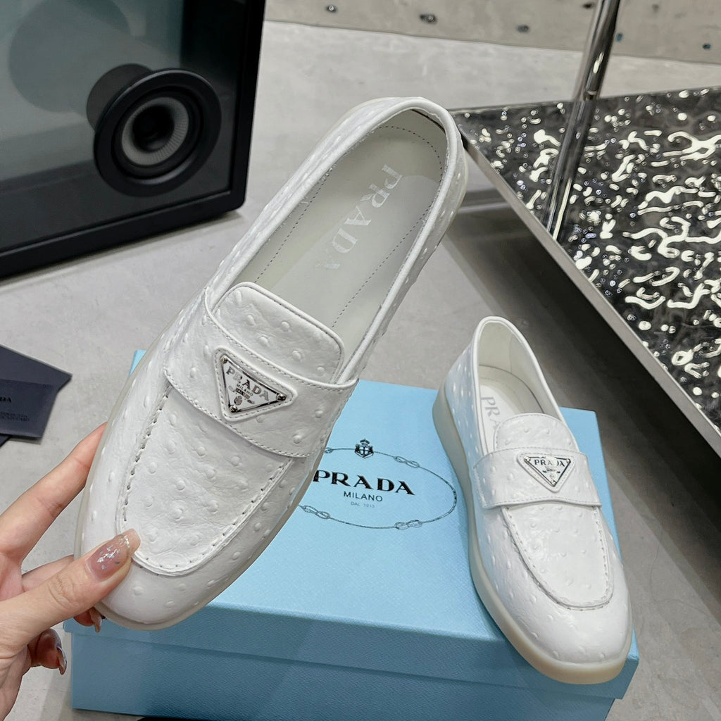 Ostrich Grain Metal Triangle Badge Slip-On Loafers S283422