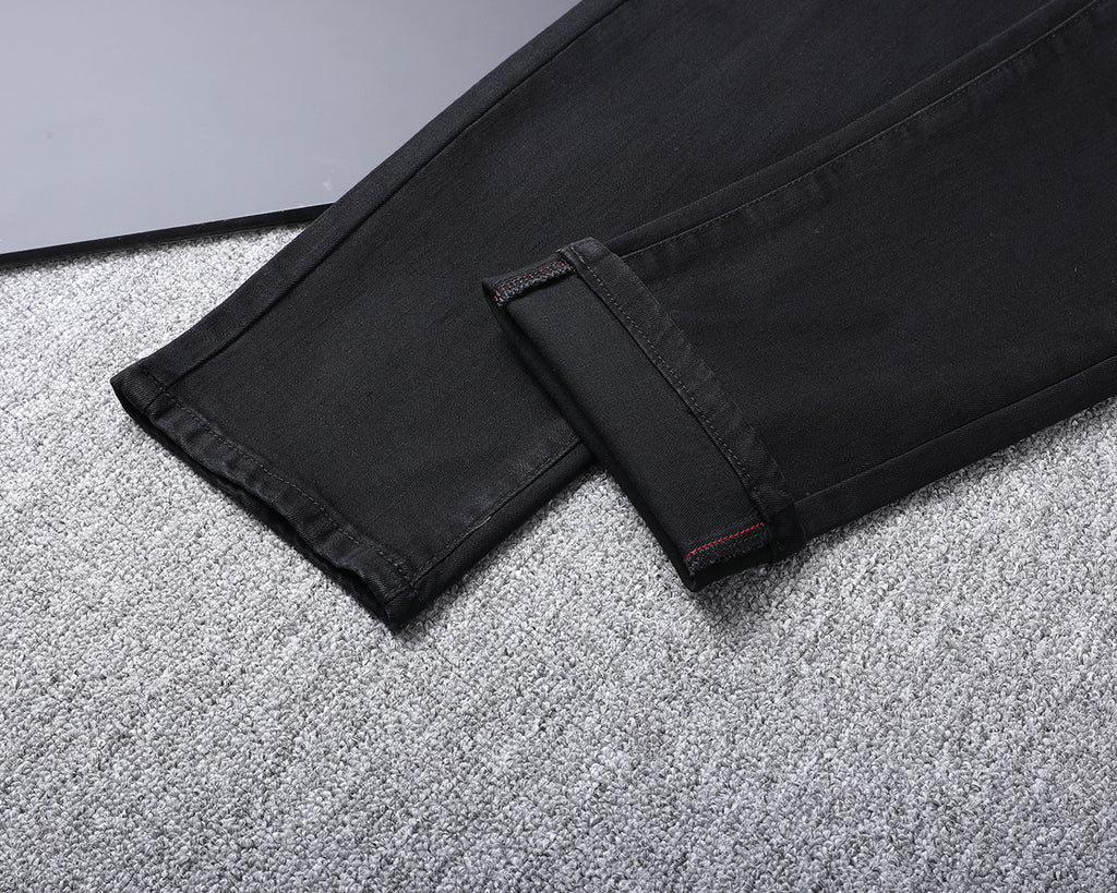 Solid Black Wash Embossed Monogram Jeans V260815