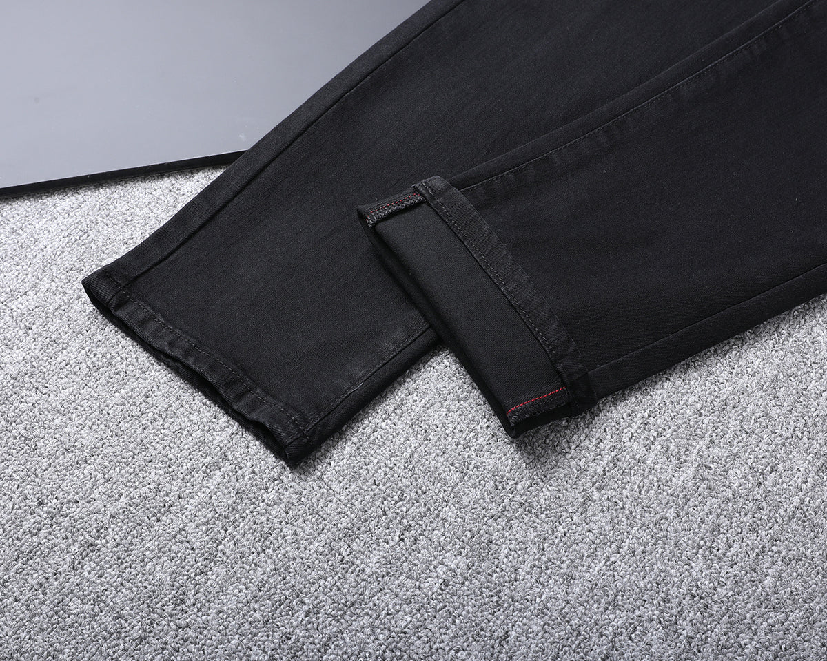 Solid Black Wash Embossed Monogram Jeans V260815