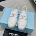 Ostrich Grain Metal Triangle Badge Slip-On Loafers S283422