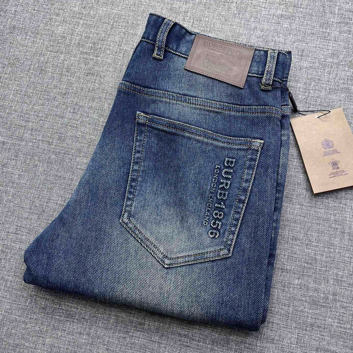 Vintage Fade Blue Embossed Text Jeans M260721