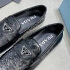 Ostrich Grain Metal Triangle Badge Slip-On Loafers S283422