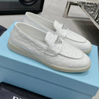 Ostrich Grain Metal Triangle Badge Slip-On Loafers S283422