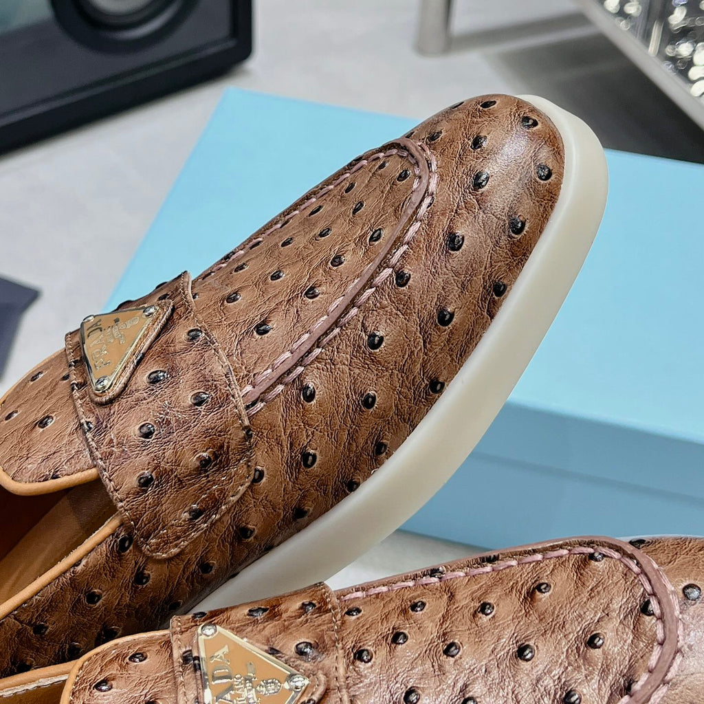 Ostrich Grain Metal Triangle Badge Slip-On Loafers S283422