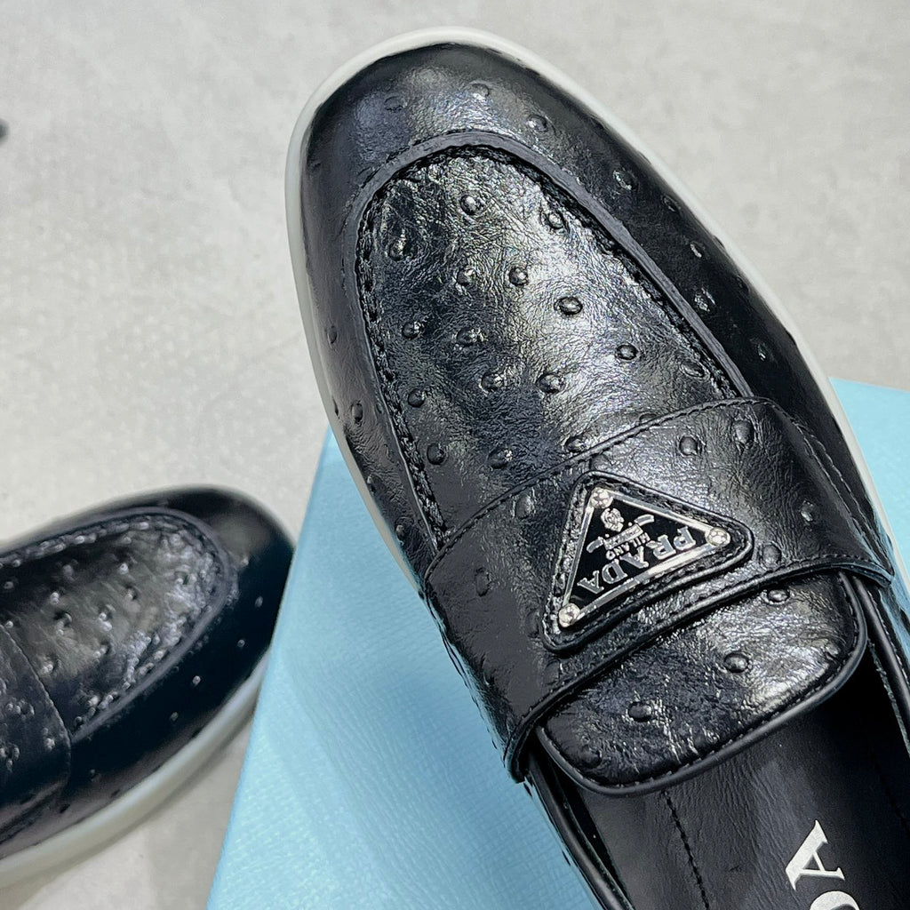 Ostrich Grain Metal Triangle Badge Slip-On Loafers S283422