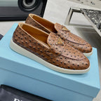 Ostrich Grain Metal Triangle Badge Slip-On Loafers S283422