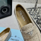Ostrich Grain Metal Triangle Badge Slip-On Loafers S283422