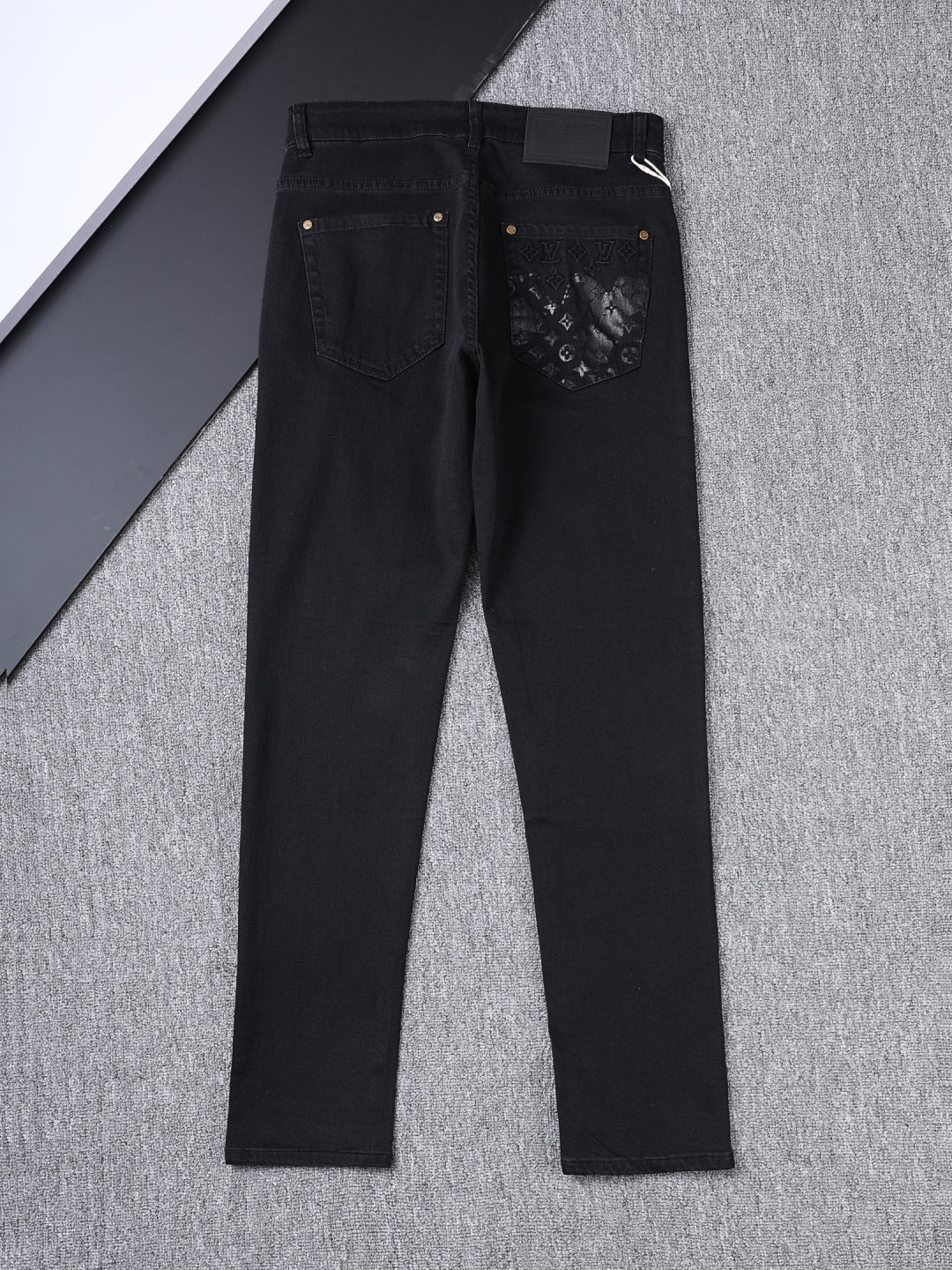 Solid Black Wash Embossed Monogram Jeans V260815