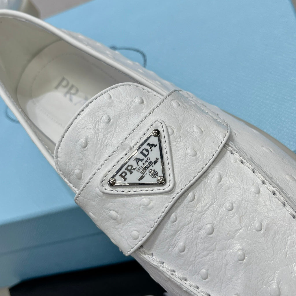 Ostrich Grain Metal Triangle Badge Slip-On Loafers S283422