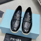 Ostrich Grain Metal Triangle Badge Slip-On Loafers S283422