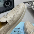Ostrich Grain Metal Triangle Badge Slip-On Loafers S283422